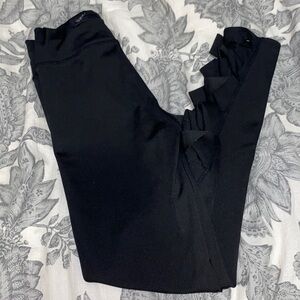 Black Leggings With Holes Through Bottom.